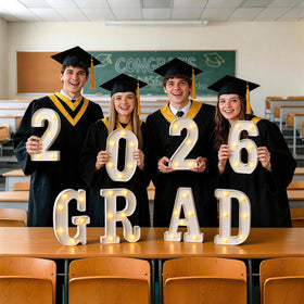 Glimmrly Grad 2026 table centerpiece display with a stable base