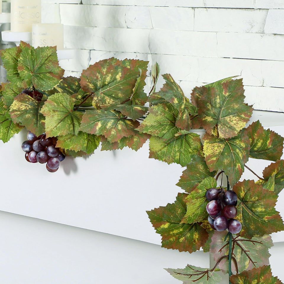 Glitinsel grape leaf garland wide view for elegant backdrops and event accents.
