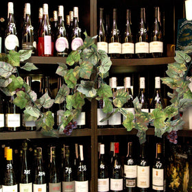 Glitinsel grape leaf garland showcases deep purple grape clusters for authentic detail.