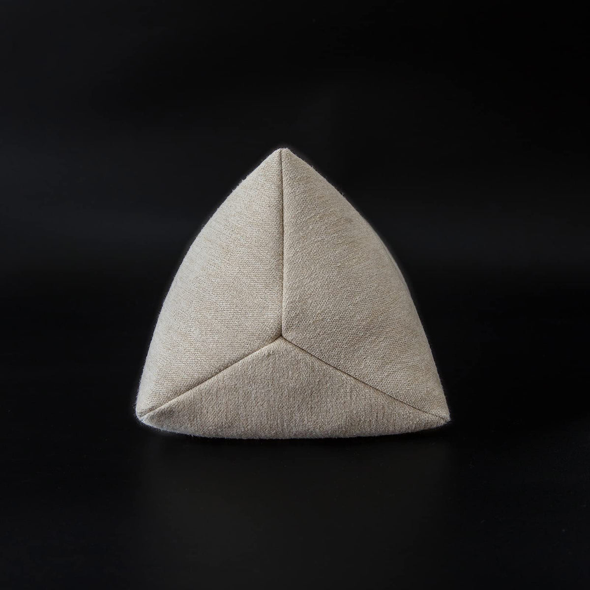 Close-up of buckwheat hulls detail inside the pillow for firm support.