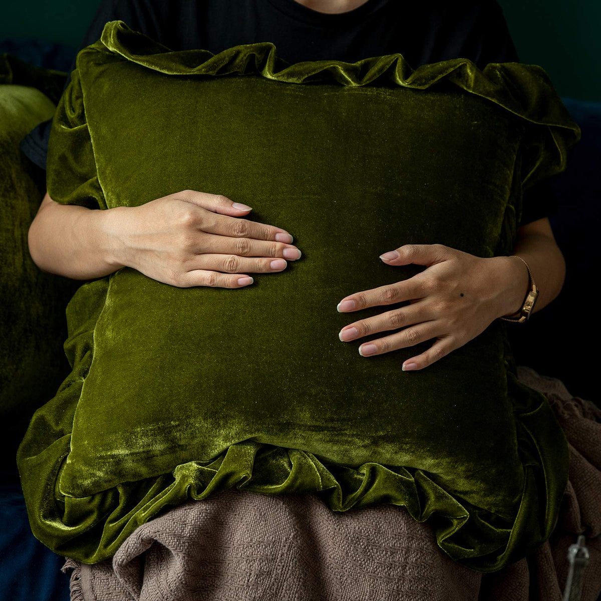 Glory Season velvet pillow cover in olive green, closeup of pleated edge detail.