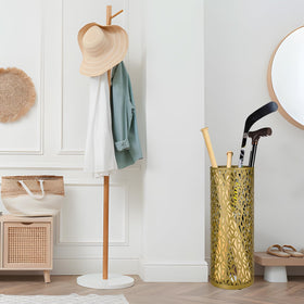 Gloserin gold umbrella stand in hotel lobby setting, versatile storage for canes and wraps