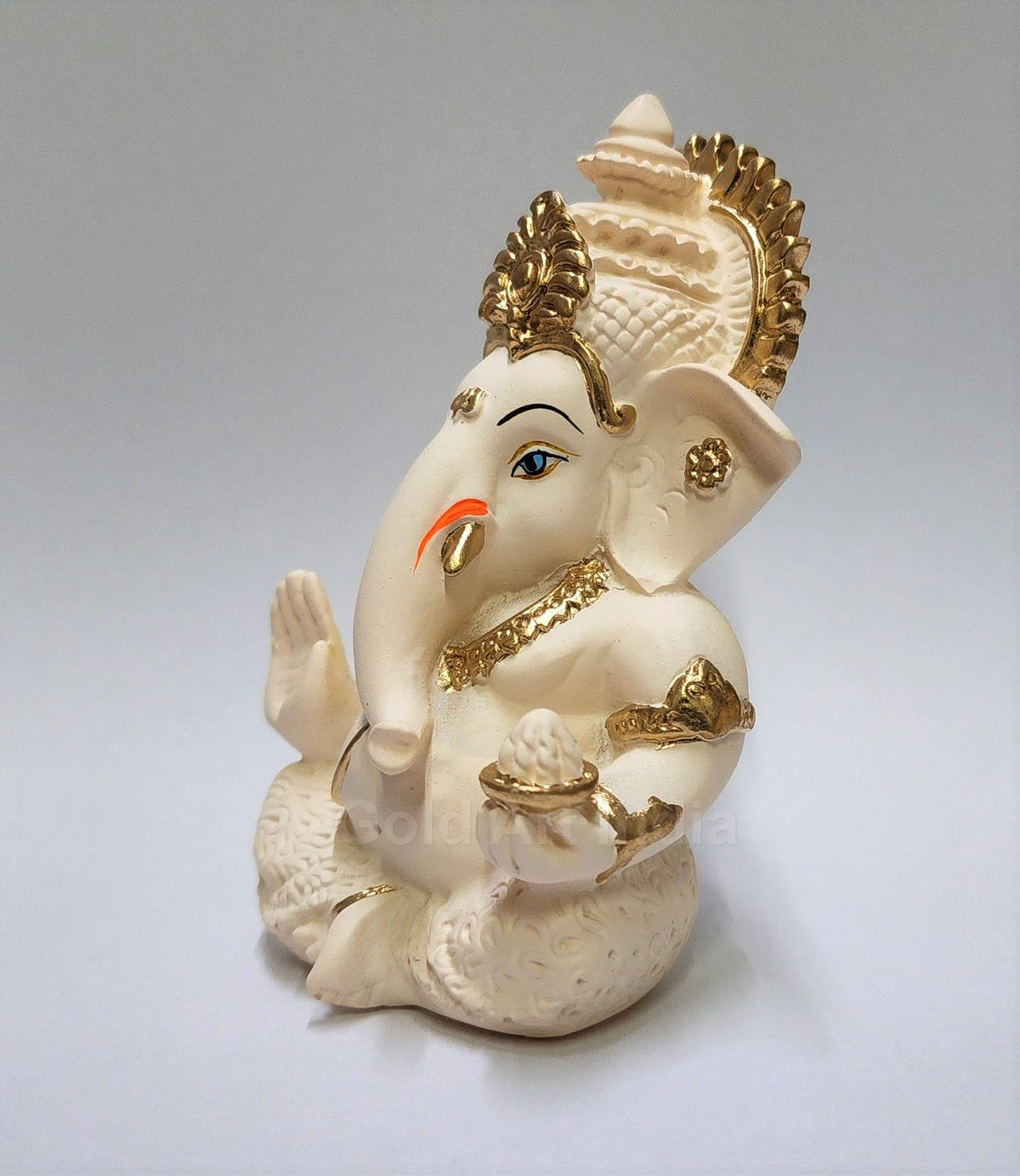 Gold Art India Ganesha idol with silver plating detail and peach ivory finish.