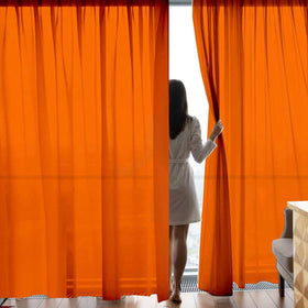 GoldLawn bright orange curtains create a warm, inviting atmosphere in any room