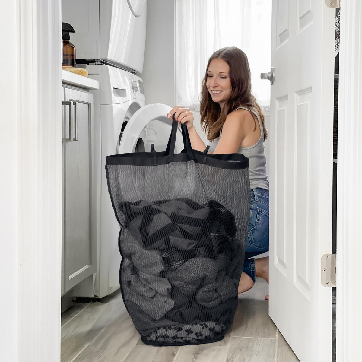 Goodpick laundry basket with lid secured over clothes between washes.