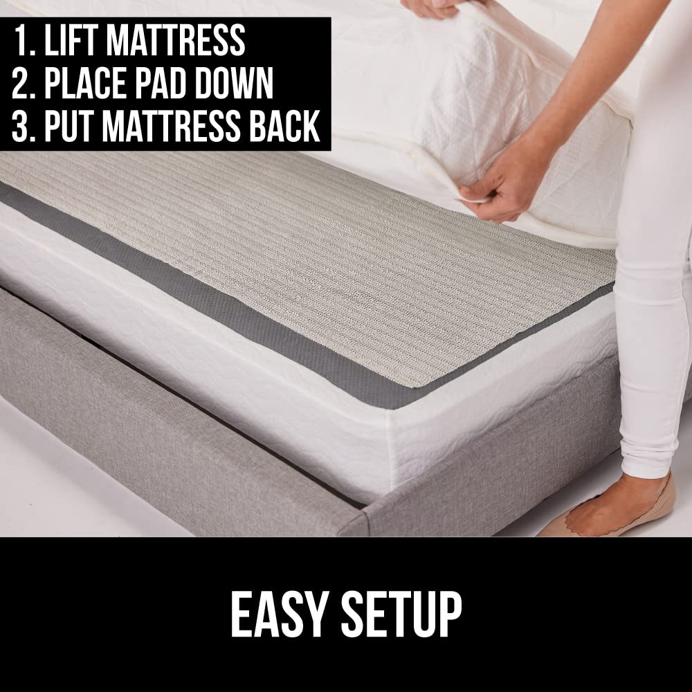 Gorilla Grip trim-ready pad being cut to fit an unusual mattress size.
