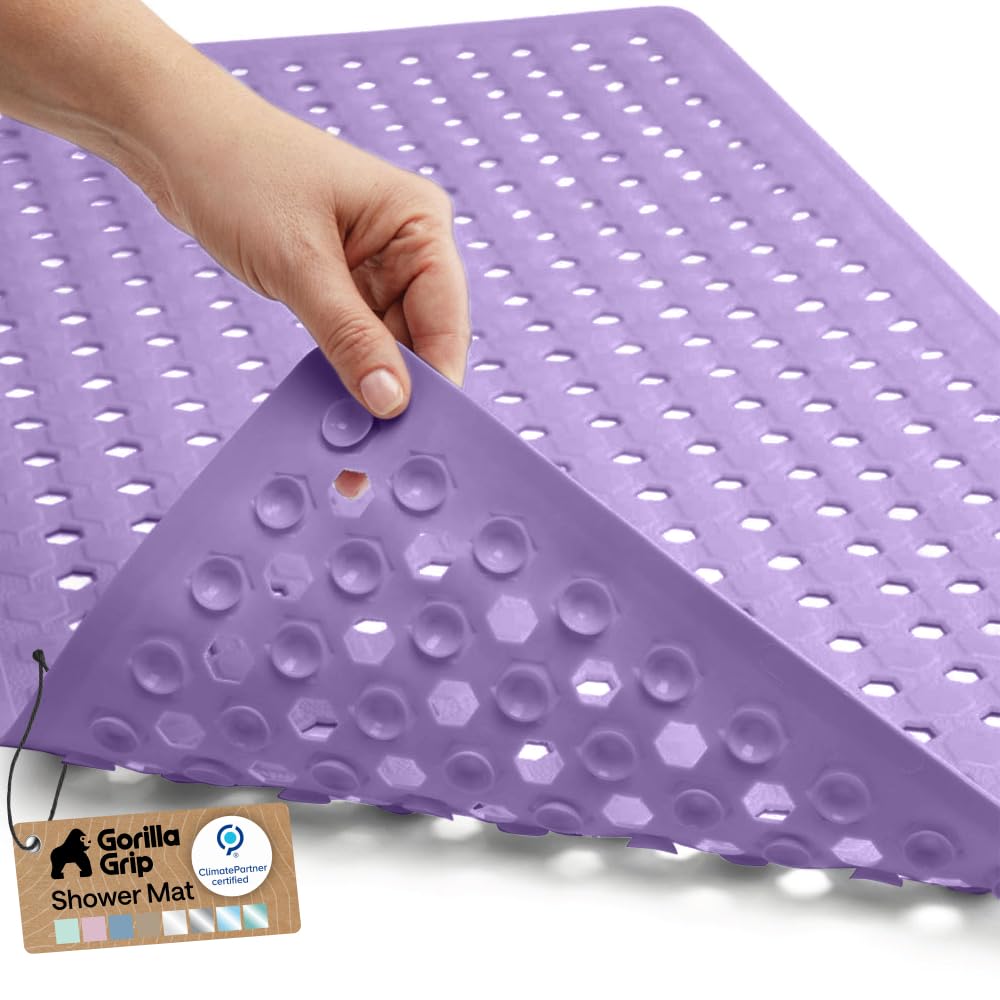 GORILLA GRIP Patented bath mat with suction cups secures tub floor.