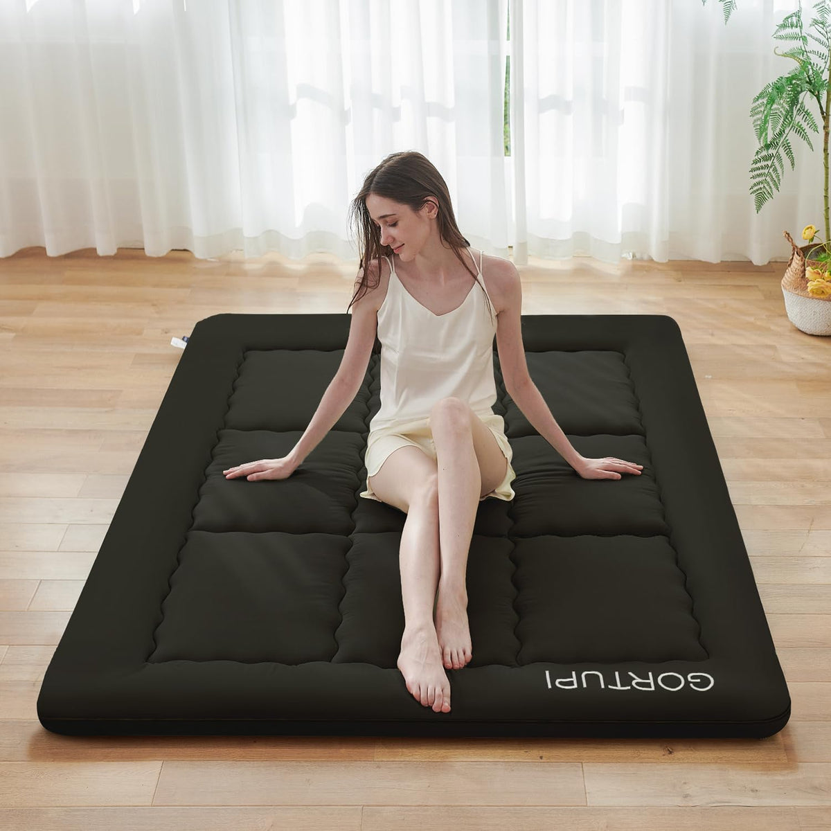 GORTUPI Japanese floor mattress in black with 3-inch foam for firm support.