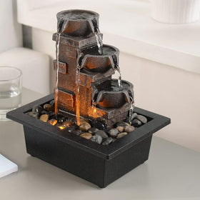 GOSSI 3-Tier Fountain side view showing natural rock-like texture and gentle water flow.