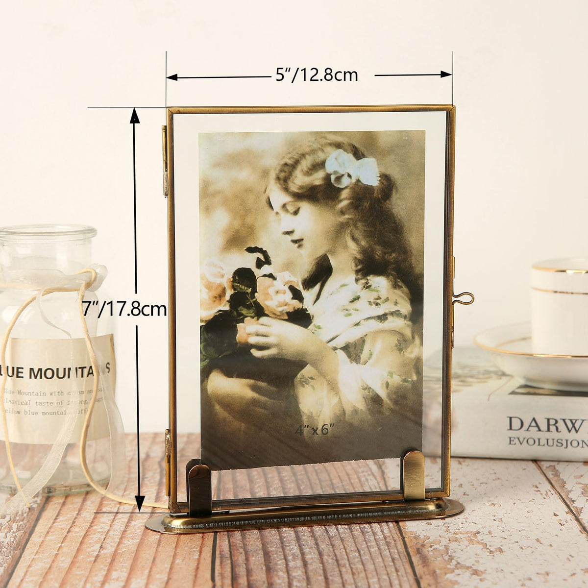 Goutangen brass floating frame close-up with double glass panels for clarity.