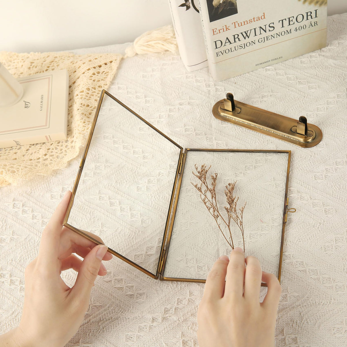Goutangen frame on table with pressed flowers inside for décor.