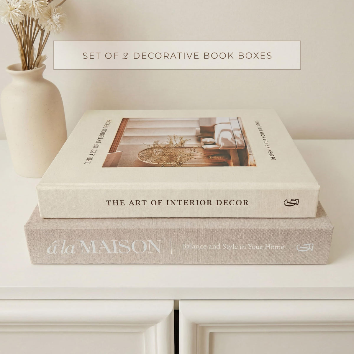 GRACEY LANE coffee table display with layered faux books and candles.
