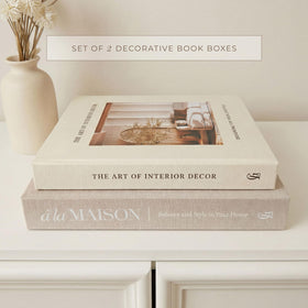GRACEY LANE coffee table display with layered faux books and candles.