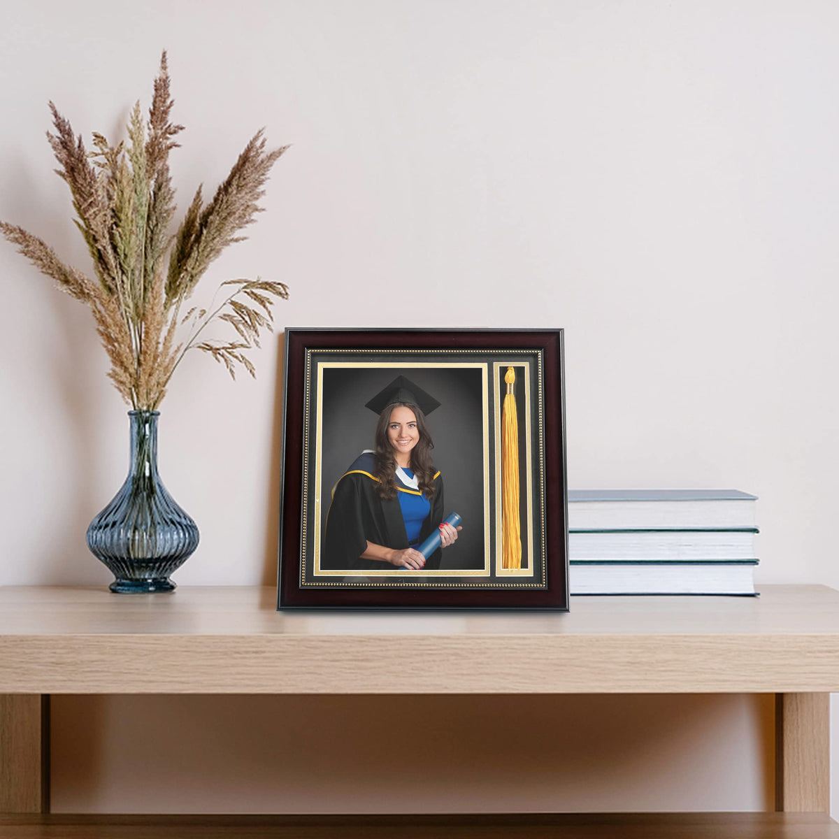 GraduationMall tassel holder securely displays graduation tassels beside photos.