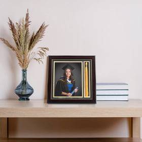 GraduationMall tassel holder securely displays graduation tassels beside photos.