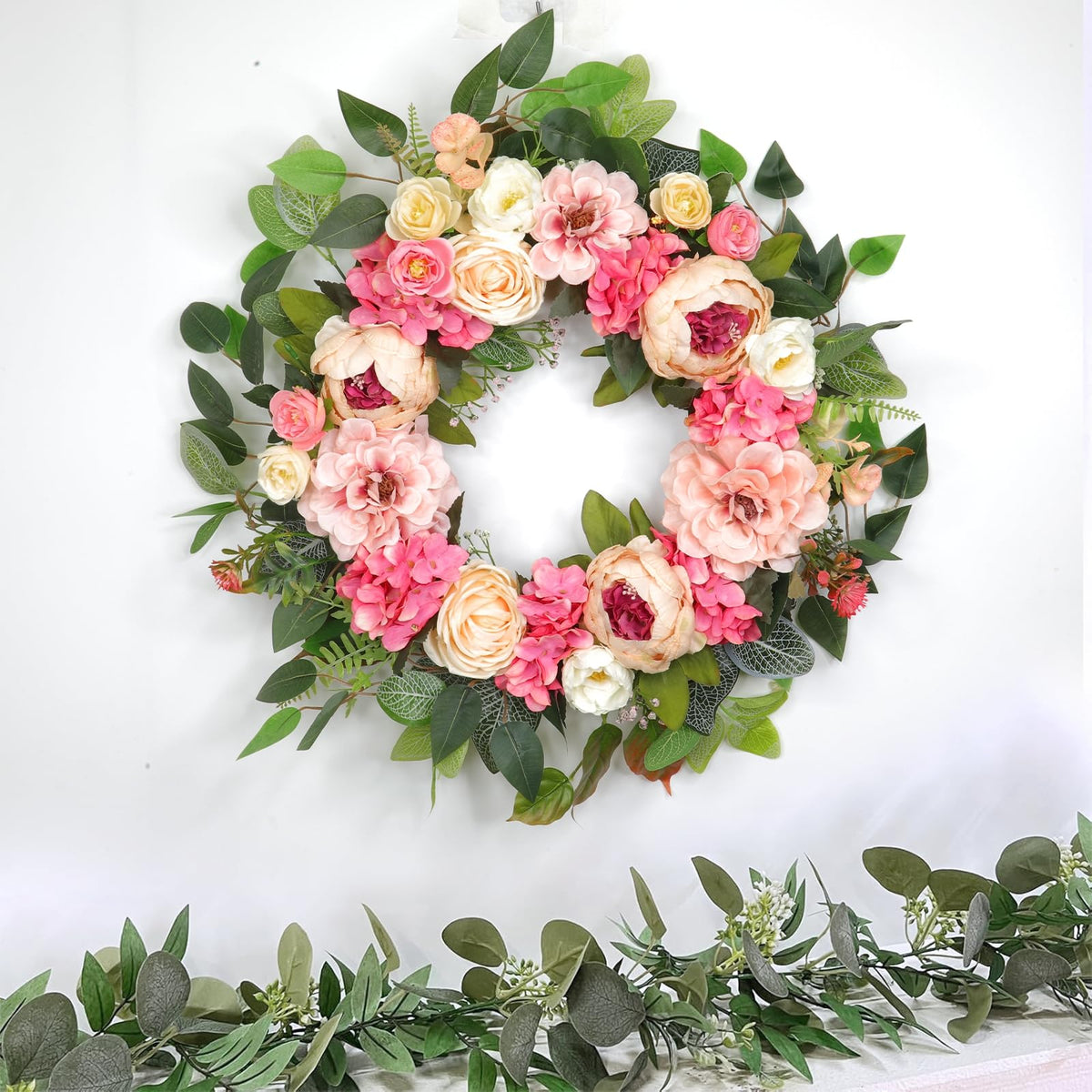 Grandeal indoor-outdoor wreath works on doors, walls, and porches.