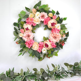 Grandeal indoor-outdoor wreath works on doors, walls, and porches.