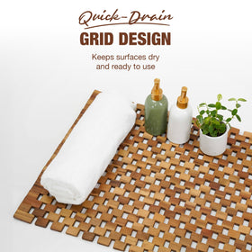 Green Alluvium Acacia Wood Bath Mat’s natural wood grain complements any bathroom style.