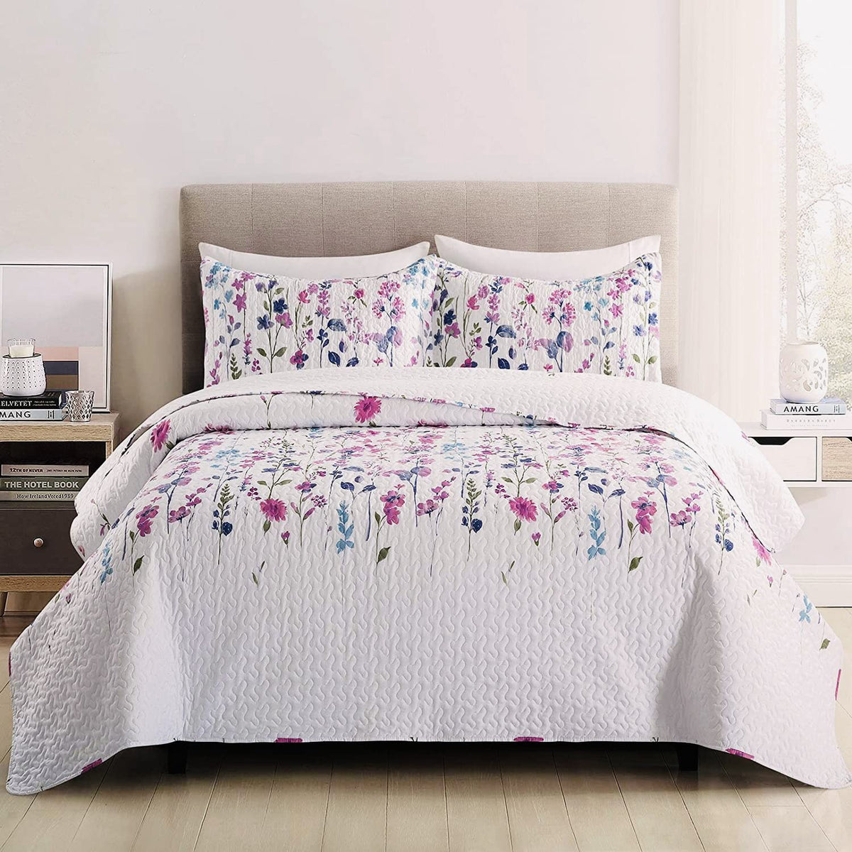 Green Essen purple lilac pillow shams complement the quilt for a cohesive look