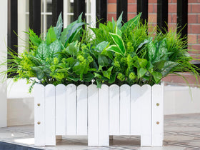 Green Moon easy-care artificial plants simplify busy spaces.