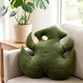 Green Philosophy Co. Monstera Leaf Pillow bed-side view adds soft texture and decorative warmth.
