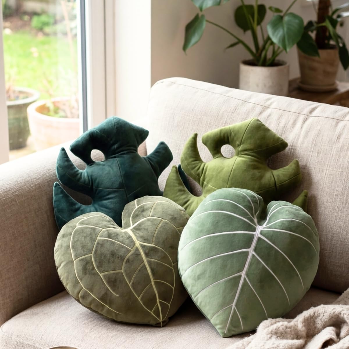 Green Philosophy Co. Monstera Leaf Pillow bedroom décor adds natural charm.