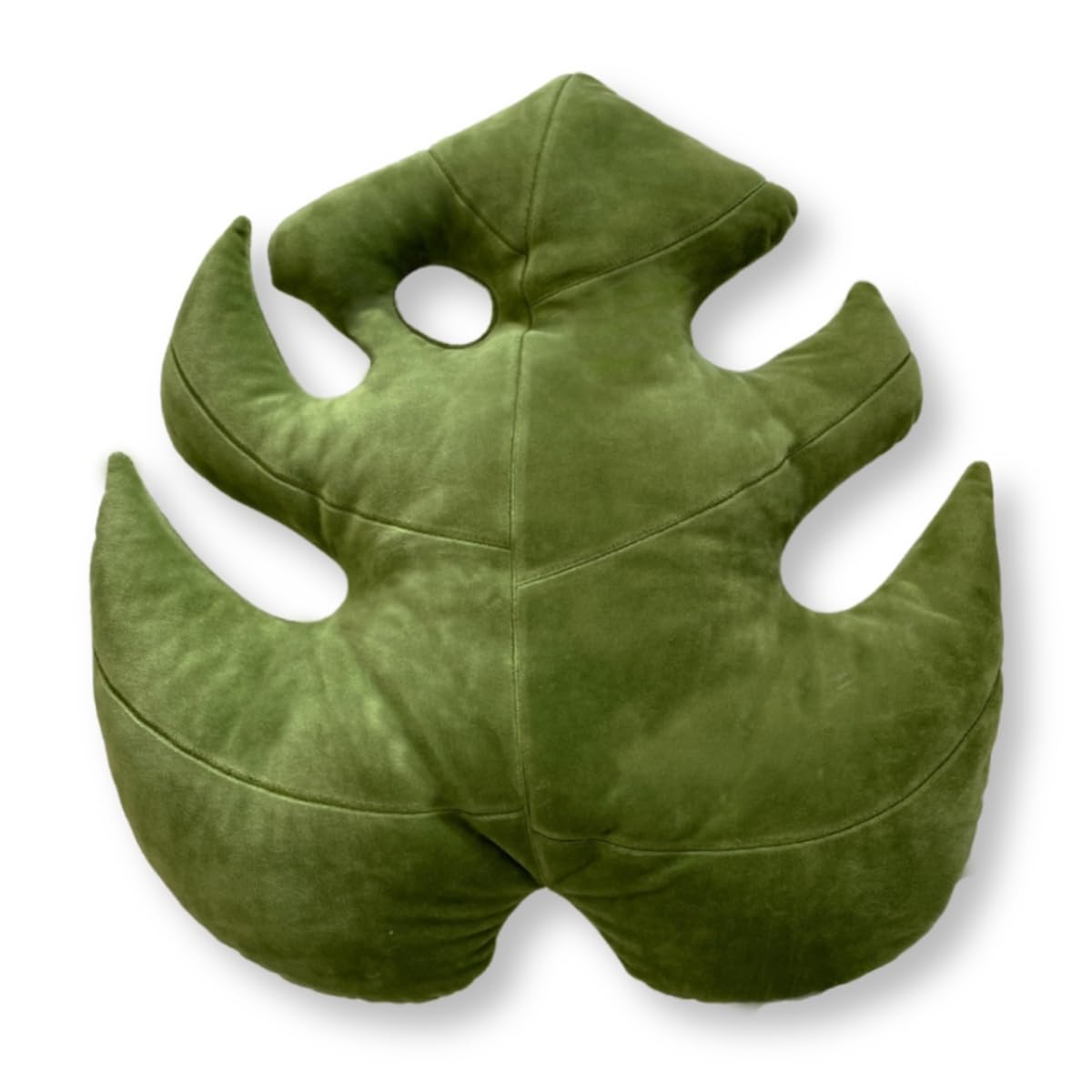 Green Philosophy Co. Monstera Leaf Pillow, front view, adds tropical charm and cozy comfort to your sofa.