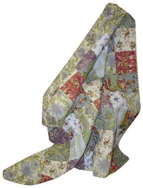 Blooming Prairie Throw folded neatly on a bed