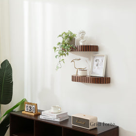 GRID FORTE shelf holding books and photo frames to maximize wall space