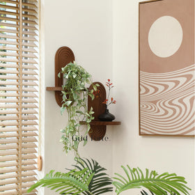 GRID FORTE mid-century arch shelves for stylish display of keepsakes and plants.