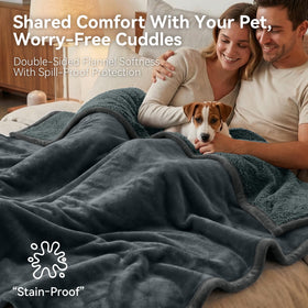 GROOSE waterproof blanket on bed in silver gray protects bedding from spills.