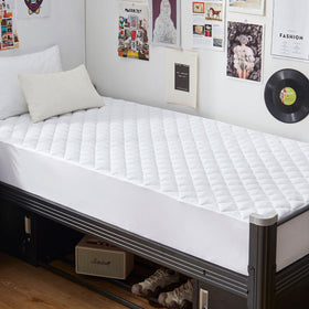 GRT Twin XL waterproof mattress pad showing waterproof membrane protects against spills