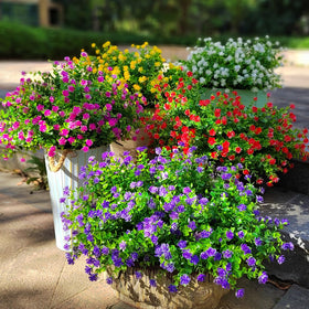 Grunyia purple faux flowers create an inviting entryway focal point.