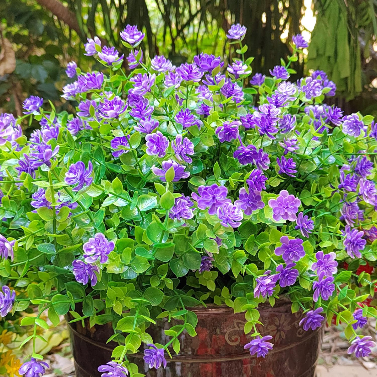 Grunyia UV-resistant purple faux blooms for a durable front porch display.