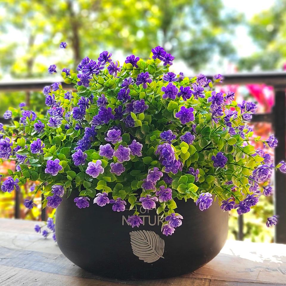Grunyia 12-bundle outdoor purple artificial flowers brighten a window box.
