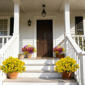 Grunyia hanging planter display of yellow artificial flowers for a porch