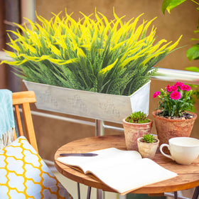 Grunyia indoor/outdoor decor with yellow flowers for versatile styling.