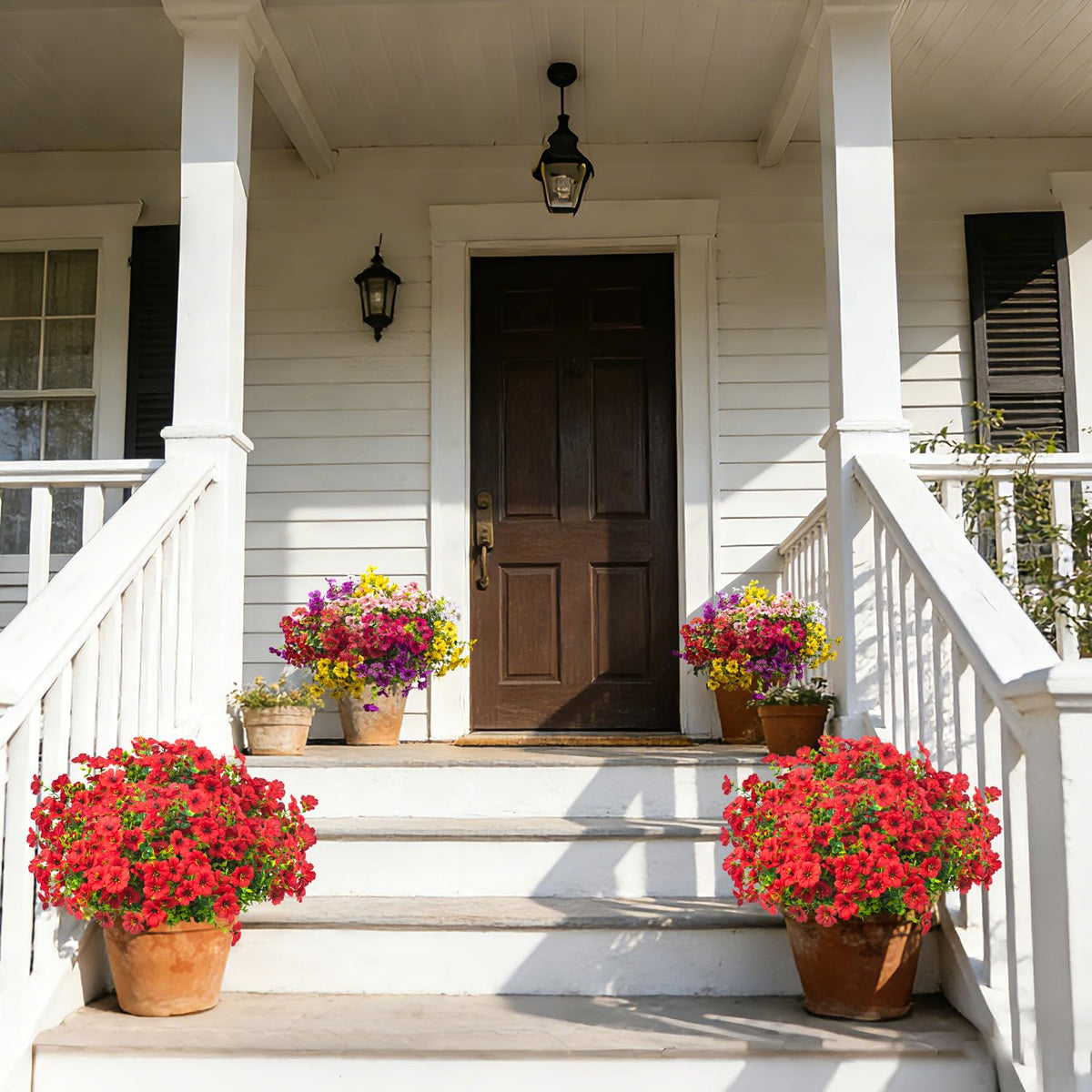 Grunyia outdoor artificial flowers arranged in hanging planters for porch decor.