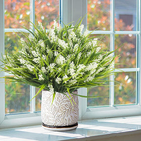 Grunyia outdoor artificial greenery creates a natural look on patios.