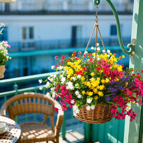 Grunyia porch decor uses vivid blooms to add seasonal warmth.