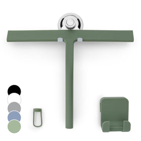 GÜTEWERK silicone squeegee in green on glass door for streak-free shine.