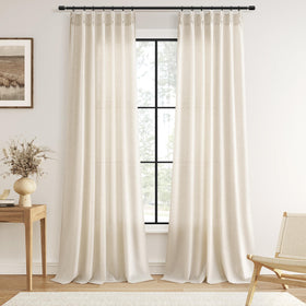 Guken pinch pleated linen curtains in a living room setup, diffused light creates a welcoming ambiance