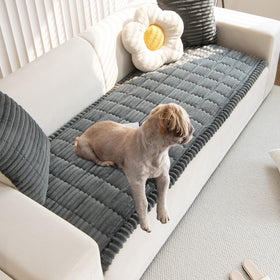 Gumfolk pet couch cover in dark grey on sofa protects against scratches.