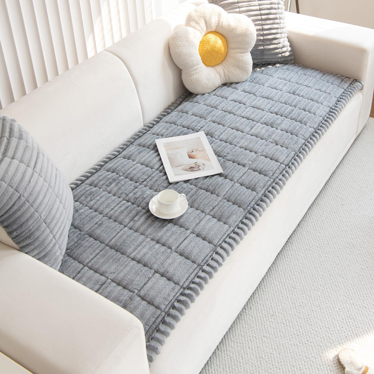 Gumfolk grey 27in-59in cover on sofa during playtime protects furniture.