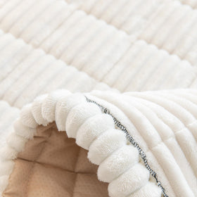 Gumfolk couch cover is machine washable for easy cleanup after adventures.