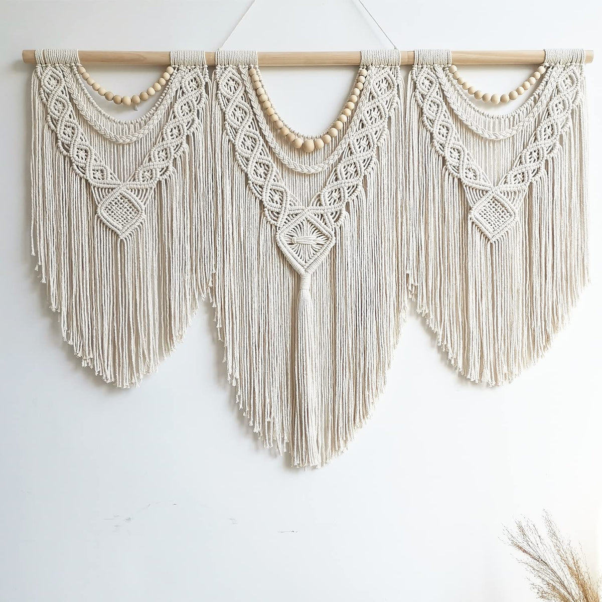 Guzhiou large macrame wall hanging with wooden dowel for bold room decor.