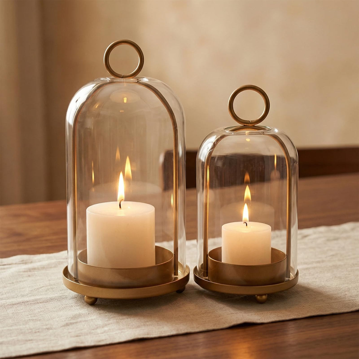 Antique brass base detail on the GYKLE lantern highlights sturdy construction.