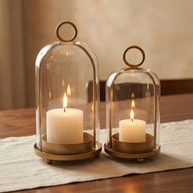 Antique brass base detail on the GYKLE lantern highlights sturdy construction.