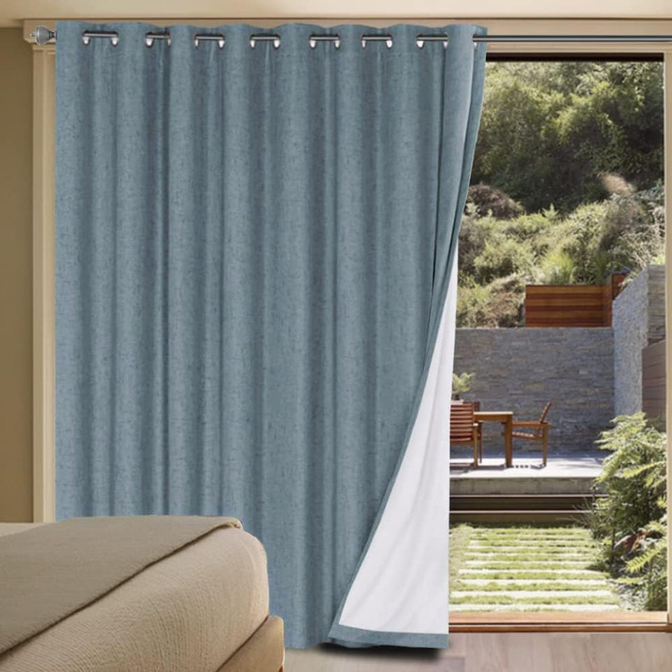 H.VERSAILTEX linen blackout curtain panel in stone blue blocks light and adds privacy.