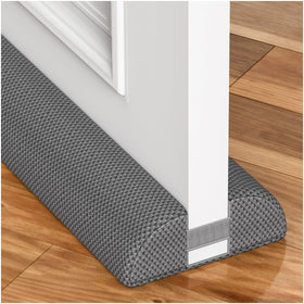 HADOR 30-inch door draft stopper installed under a door to reduce drafts.